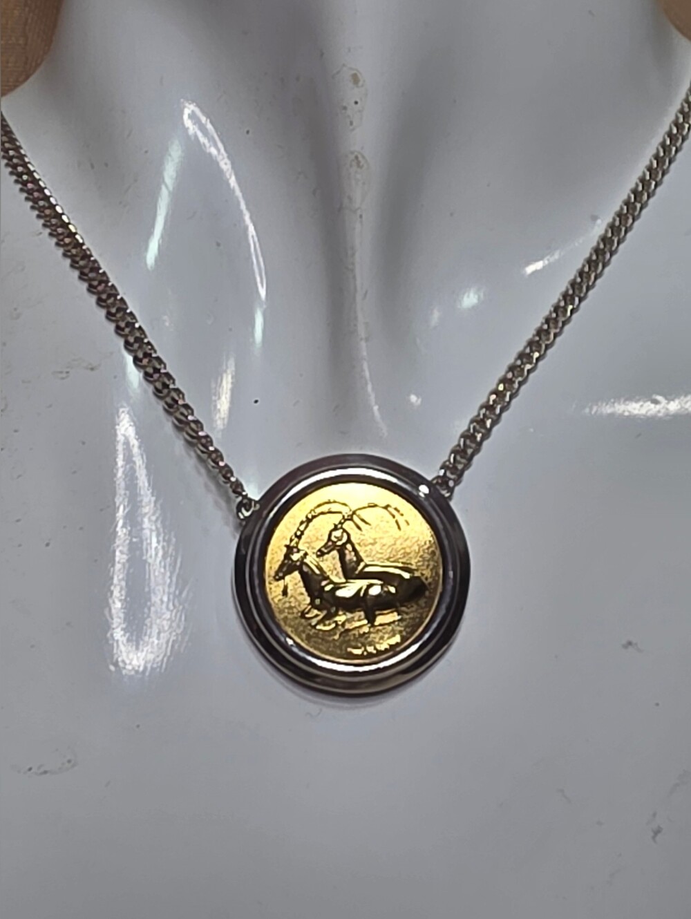 SOLID 18K LLIAS LALAOUNIS GREEK GOLD COIN SET IN A 925 BEZEL AND AN 18IN CHAIN